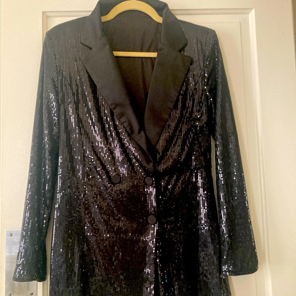 Black fitted sequince and silk colored Scort shorts attached to jacket. Size 4-6